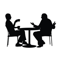 Two people sitting at a table. One of them is holding a cup. The table is round
