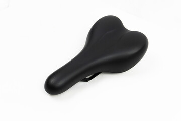 a black comfortable bicycle saddle It is designed to be for the rider on white background.