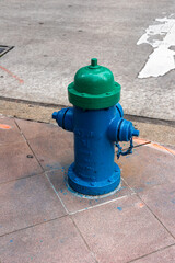 Fototapeta premium Blue and green fire hydrant on the street