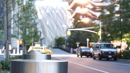 New York City, United States. Hudson Yards architecture in Chelsea, Manhattan Midtown building, NYC, USA. Defocused people, urban road car traffic, 34 street. Yellow taxi on crossroad intersection.