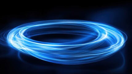 Naklejka premium A glowing blue circular motion against a dark background, creating a sense of dynamic energy and movement.