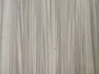 Natural vertical wood grain texture with soft neutral tones, perfect for backgrounds, designs, or architectural concepts.