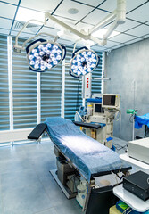 Modern surgical suite with advanced tools. A clean and organized surgical suite showcases advanced medical equipment ready for an operation.