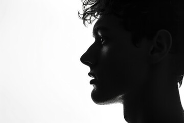 Silhouette portrait of young European man on white background.