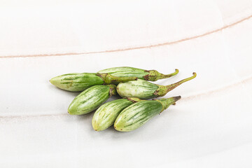 Small organic young green eggplant