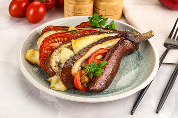 Baked tomato with mozzarella and tomato