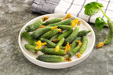 Raw gherkin cucumbers in the bowl