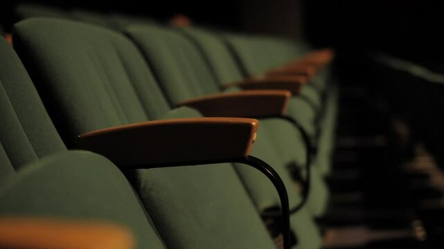 Empty green theater seat for sitting at a conference or a show