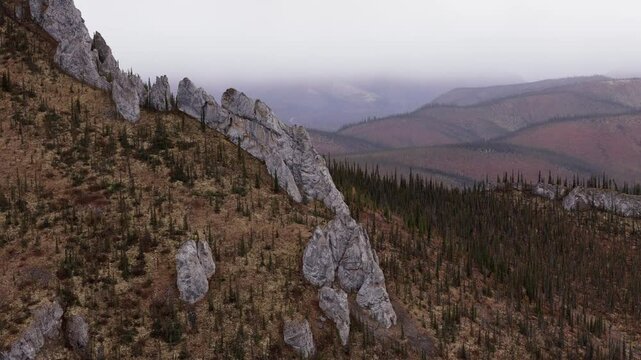 Rocky Outcrops On Sapper Hill With Autumn Foliage. Yukon Territory, Canada. drone shot