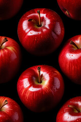 Several shiny red apples with water droplets closely together. Suitable for food or healthy eating concepts, autumn themes, and agriculture.