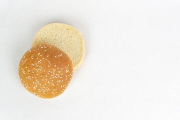 Hamburger buns with sesame seeds on white isolated background