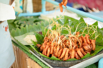 Fried pork at a rural market in Thailand