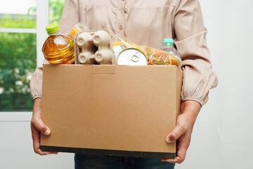 Foodstuffs in donation box for volunteer to help people.
