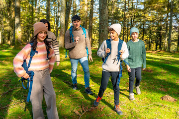 Fototapeta premium Family enjoying hiking together in the forest