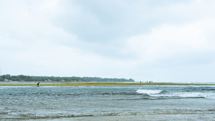 view of the sea, with sand, coral, blue sky and sea waves. Holiday background in Sukabumi, West Java. Indonesia
