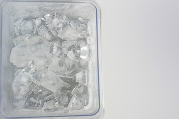Pile of ice cubes isolated on grey background. ice cube for fresh drink.