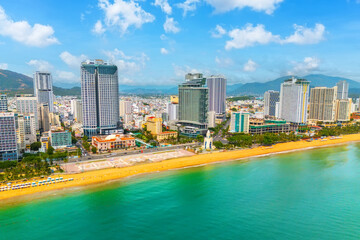 Naklejka premium Beach overlooking aerial view city skyscrapers on the coast of April 2nd Square Agarwood Tower. Vietnam, Nha Trang, 19 September 2024