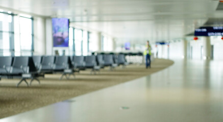 BLURRED OFFICE BACKGROUND, MODERN BUSINESS HALL WITH LIGHT REFLECTONS ON THE FLOOR,abstract blur in airport for background.
