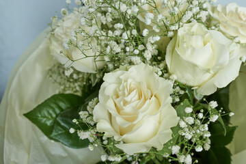 Beautiful bouquet of white roses and gypsophila flowers