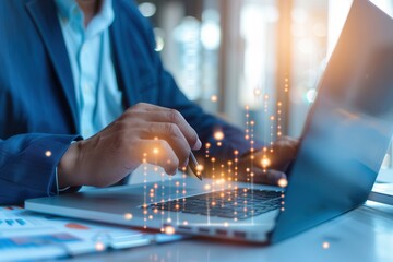 Close-up of a businessman using a laptop with digital data overlay, symbolizing technology-driven analysis, innovation, and business productivity.