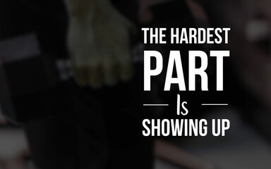 Motivational quote: 'The hardest part is showing up,' set against a blurred gym background, encouraging persistence and the importance of starting.