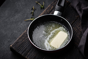 Melted butter on in iron pan