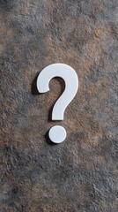 Explore the mystery of uncertainty with a striking white question mark on a dark textured background for creative endeavors