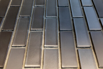 Silver-gray wall made of ceramic facing hollow bricks. Diminishing Perspective. Image for...
