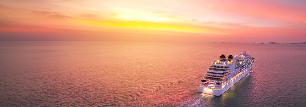 Cruise Ship at sunset, Cruise Liners beautiful white cruise ship above luxury cruise in the ocean sea concept exclusive tourism travel on holiday take a vacation time on summer.