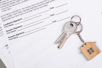 Rental or Residential Lease agreement contract and house keys. Short and long term rentals, housing searching crisis, signing lease agreement, and rising prices.