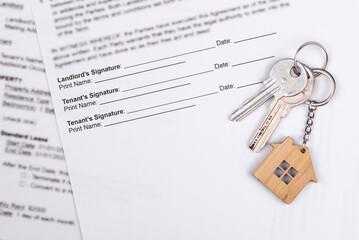 Rental or Residential Lease agreement contract and house keys. Short and long term rentals, housing searching crisis, signing lease agreement, and rising prices.