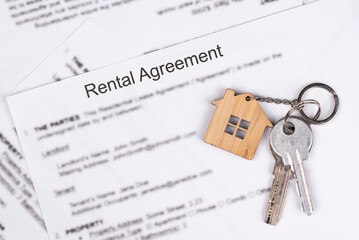 Rental or Residential Lease agreement contract and house keys. Short and long term rentals, housing searching crisis, signing lease agreement, and rising prices.