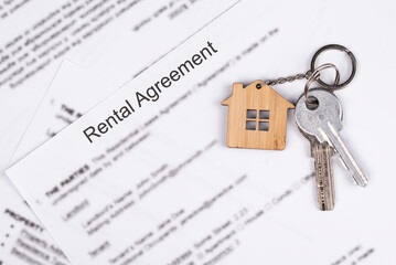 Rental or Residential Lease agreement contract and house keys. Short and long term rentals, housing searching crisis, signing lease agreement, and rising prices.