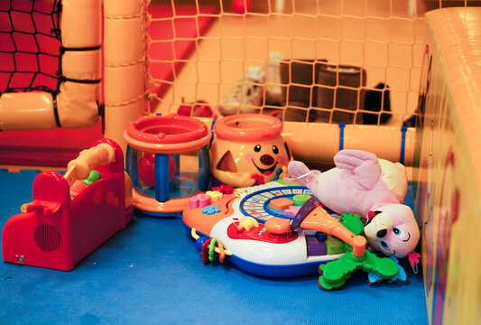 Mix of toys in a corner of a play room