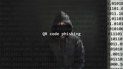 QR code phishing text in foreground screen, anonymous hacker hidden with hoodie in the blurred background. Vulnerability text in binary system code on editor program.