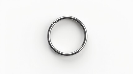 Close-up of a silver ring on a white background, minimalist design