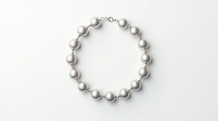 Obraz premium Elegant silver pearl necklace on a white background