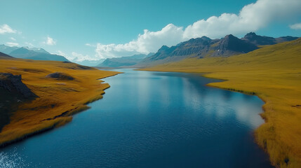 Aerial View of Stunning Icelandic Landscape with Majestic Mountains and Serene Lake Under Blue Skies
