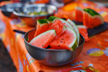Juicy Delight: A Vibrant Bowl of Refreshing Watermelon Slices Bursting with Summer's Sweetness and Colorful Charm.