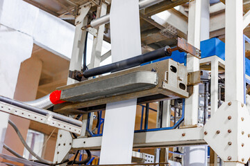 Rugged Innovation: A close-up of a powerful industrial machine, showcasing intricate gears and...