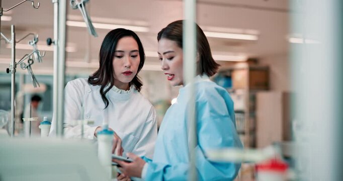 Science, lab and Asian people on tablet with machine for research, medical study and teamwork. Healthcare, biotechnology and Japanese women on tech for discovery, vaccine and dialysis medicine