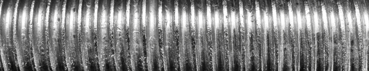 Texture of metal bolt thread. Abstract banner.