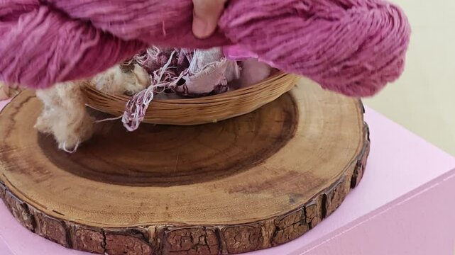 Spool of pink cotton thread, natural pink color from shellac. Lac or Laccifer.