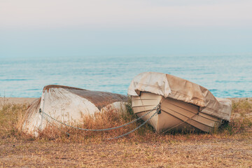 Old lifeboats at Aegean sea shoreline