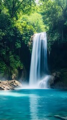 Mesmerizing Tropical Waterfall Amid Lush Verdant Foliage in Natural Landscape Photography