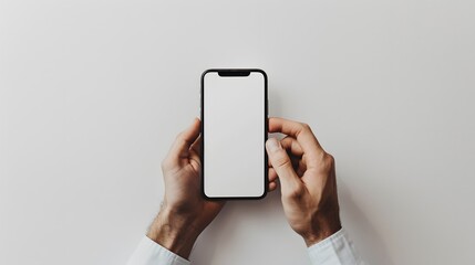 A man’s hand holds a smartphone. A phone is carried by a man in a white scene. A man’s hand and a clean design.