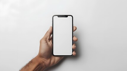 A man’s hand holds a smartphone. A phone is carried by a man in a white scene. A man’s hand and a clean design.