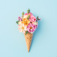 Ice cream cone without ice cream, with flowers, pastel colors
