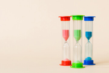hourglass on the table, sand clock as time passing concept for business deadline, copy space