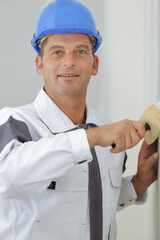 happy painter man smiles at the camera © auremar